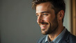 © unairakstudio - A professional man in a suit smiles confidently, exuding positivity and approachability.