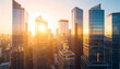 © Hamky - Stunning urban landscape of a modern metropolis with towering financial district buildings glowing at sunrise or sunset.