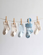 © Nieke - Baby socks hanging on a clothesline, newborn concept, baby shower, announcement