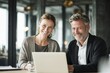 © ttonaorh - Young business man and woman working together in an office, having fun while looking at a computer screen with happy gestures on their hands. the smiling female appears surprised.