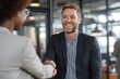 © ttonaorh - Happy businessman shaking hands with his new friend in the office.