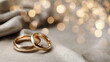 © mohammad - Wedding Planner, wedding rings on satin cloth, soft bokeh lights