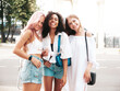 © halayalex - Three young beautiful smiling hipster female in trendy summer clothes.Sexy carefree multiracial women posing on the street background.Positive models having fun