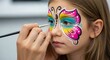 © 爱心 - Girl with Butterfly Face Paint Being Applied | Close Up of Child Getting Colorful Face Painting Design for Parties and Celebrations