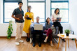 © oneinchpunch - Startup business team posing in modern office