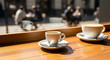 © MindsTock - Freshly brewed coffee cups on a wooden counter at an outdoor urban cafe for morning break and social lifestyle concept