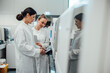 © Westend61 - Scientists working with tablet in clean laboratory environment