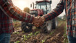 © Taiwo - Two farmers shaking hands, farmer in office on the farm with red tractor on a sunlit background. farmer handshake, farmer shaking hands business agreement deal agriculture investment landscape farming