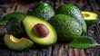 © khumthong - Fresh Ripe Avocados on Rustic Wooden Tabletop Healthy Green Fruit and Vitamins Closeup Food