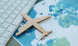 © Pawel - A wooden airplane is on top of a map of the world