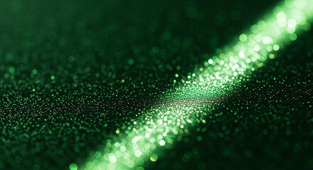 Green sparkles and bokeh effect on a dark background