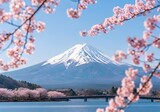 Iconic mount fuji in spring surrounded by blooming cherry blossoms and a tranquil lake