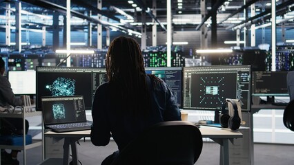 server farm software developer interprets ai generated data analytics graphs. data center specialist