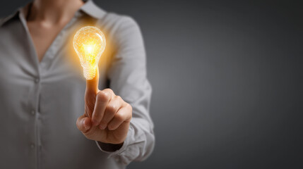 Wall Mural - person holding glowing light bulb with thoughtful expression, symbolizing creativity and innovation.