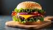 © Mili - Juicy cheeseburger with beef patty, melted cheese, crispy bacon, fresh lettuce, tomato, onion, and sesame bun served with golden French fries. Delicious fast food meal on a wooden board.
