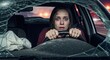 © Flash memory - A young woman in a crashed vehicle with a shattered windshield, looking visibly scared and holding the steering wheel.