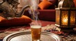 © Mikhail - Pouring hot moroccan mint tea into a traditional glass on a silver tray in a cozy room