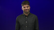 © Krakenimages.com - Young hispanic man wrinkles nose and scrunches face in a vivid deep blue studio setting wearing a dark shirt; raw disgust.