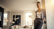 © Milan - Confident and stylish black woman in a modern luxury apartment. Portrait of a successful young professional at home. Copy space for text.