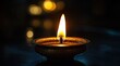 © Kettiketti - Small, ornate candle, warm flame