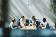© Designer's Stockroom - Business men and women wearing suit or formal outfit, discussing at their meeting with co-worker and client at   modern office in urban building.