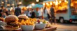 © Albi - The vibrant food scene featuring delicious burgers and fries at an outdoor market.
