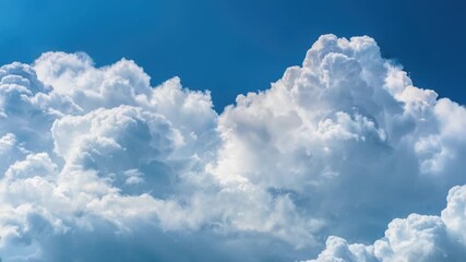 Wall Mural - a plane flying through a cloudy blue sky
