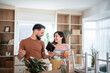 © Migma_Agency - Happy couple unpacking belongings in new home after moving house