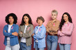 © Maria Vitkovska - Interracial women of different ages posing with pink ribbons for breast cancer awareness