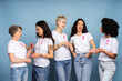 © Maria Vitkovska - Diverse women smiling and supporting breast cancer awareness together