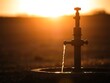 © Surendo - Sunset illumination cascading over a retro water pump, a thirst quencher