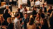 © Ray - A high-angle shot of a lively networking event. Professionally dressed people converse and mingle in a spacious, dimly lit venue. Drinks and appetizers are present.