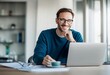 © SejutaCahaya - A smiling man in a blue sweater sits at a modern desk with a laptop, holding a cup of coffee, enjoying a productive workday in a bright, stylish office space