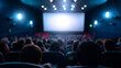 © Curioso.Photography - Audience watching movie in cinema with blue ambient lights.