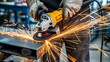 © Billing  - Worker using angle grinder with sparks in metal workshop industry