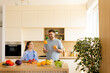 © BGStock72 - Family cooking fun in a bright kitchen with fresh fruits and vegetables