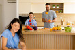 © BGStock72 - Joyful moments of cooking and juggling with friends in a sunny kitchen