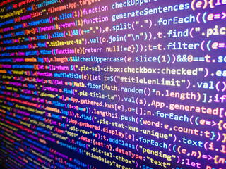 Computer code background. Colorful programming source typed on the screen of the monitor with shallow focus effect. Modern technology and futuristic concept abstract visualization of software. 
