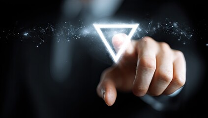 Hand interacts with glowing triangle interface