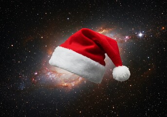Santa hat floating in space with a galaxy background for christmas