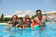 © New Africa - Happy family in swimming pool. Summer vacation
