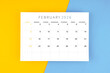 © Southtownboy Studio - February 2026 calendar page on yellow and blue color background.