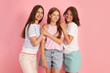 © New Africa - Portrait of happy friends on pink background