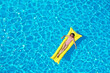 © New Africa - Girl on inflatable mattress in swimming pool, top view. Summer vacation