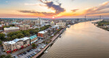 Waterfront River Street in Savannah, Georgia. Historic American architecture of old historical city. USA Southern cityscape at sunset