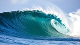 A powerful, vibrant ocean wave crashes in a breathtaking display of nature's force and beauty, showcasing a dynamic, turquoise curve against a clear sky.