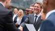 © buraratn - Building professional relationships is essential in business world, as seen in this of group of diverse professionals engaging in handshake and smiling