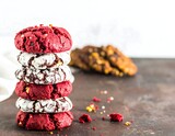 Stack of red velvet cookies with others blurred in background