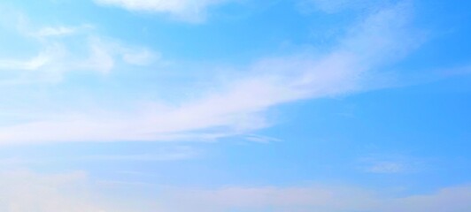 Wall Mural - Panorama view of bright blue sky with fluffy white clouds on a clear sunny day. Sky panorama clear blue with white clouds in spring. Cloudscape