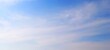 © Firman - Panorama view of bright blue sky with fluffy white clouds on a clear sunny day. Sky panorama clear blue with white clouds in spring. Cloudscape. Clear blue sky, bright spring, wallpaper landscape.
